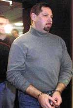 Fainberg in handcuffs