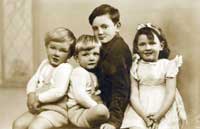 1943 photo of the Irving children - David, twin brother Nicky, John, Carol